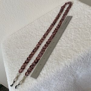 Sunglasses or mask chain.